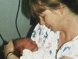 Closeup of Mom holding me after my bath